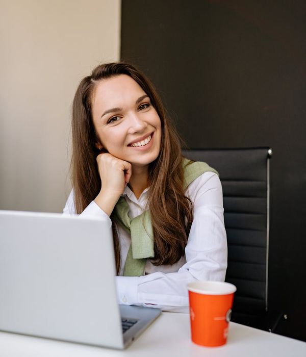 Woman feeling energetic and balanced in a bright, modern space.
